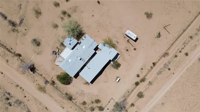 a view of a terrace with a table and chairs