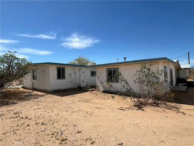 a view of a backyard of a house