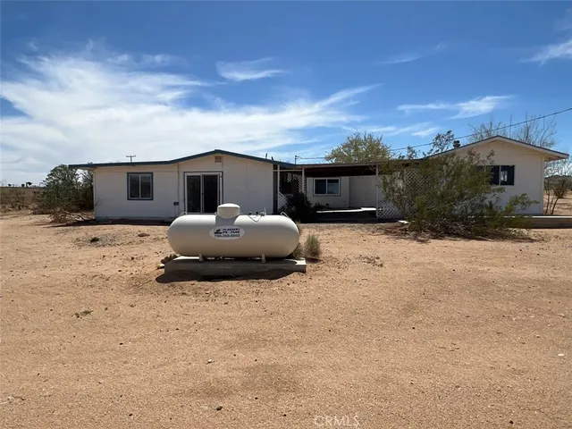 a view of a yard with a snow on the road