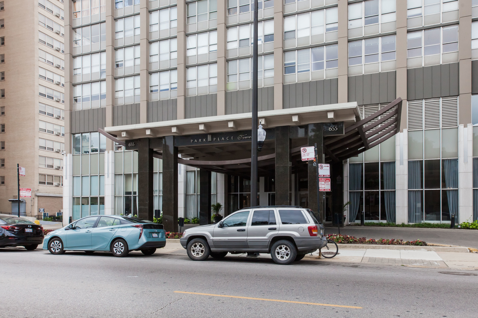 655 West Irving Park Road, Unit 1014 Chicago, IL 60613 - Photo 2 of 23 a view of a car parked in front of a building