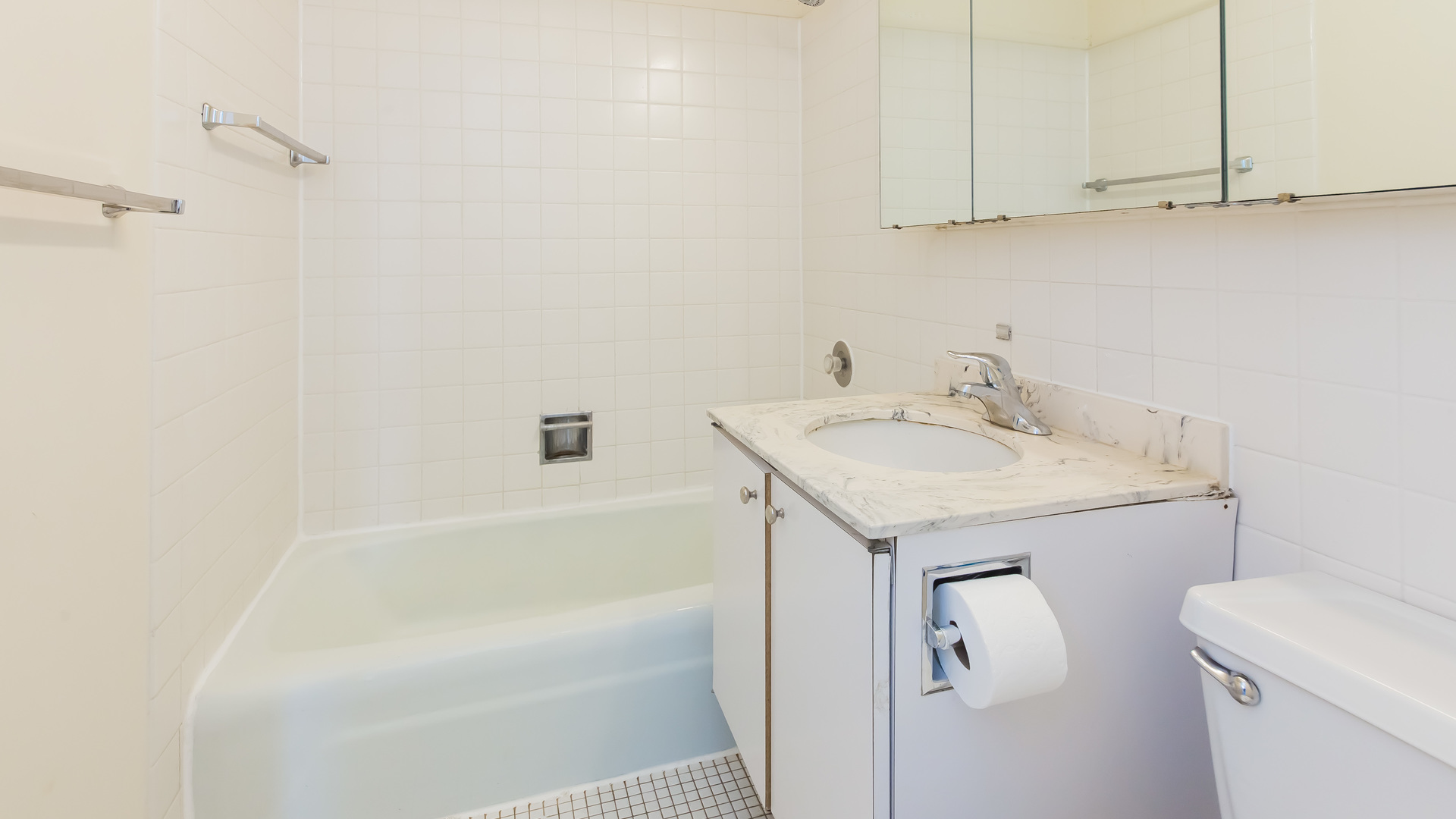 655 West Irving Park Road, Unit 1014 Chicago, IL 60613 - Photo 15 of 23 a bathroom with a sink and vanity