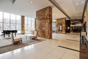 655 West Irving Park Road, Unit 1014 Chicago, IL 60613 - Photo 20 of 23 a lobby with furniture and large window