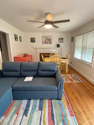 a living room with furniture and a rug