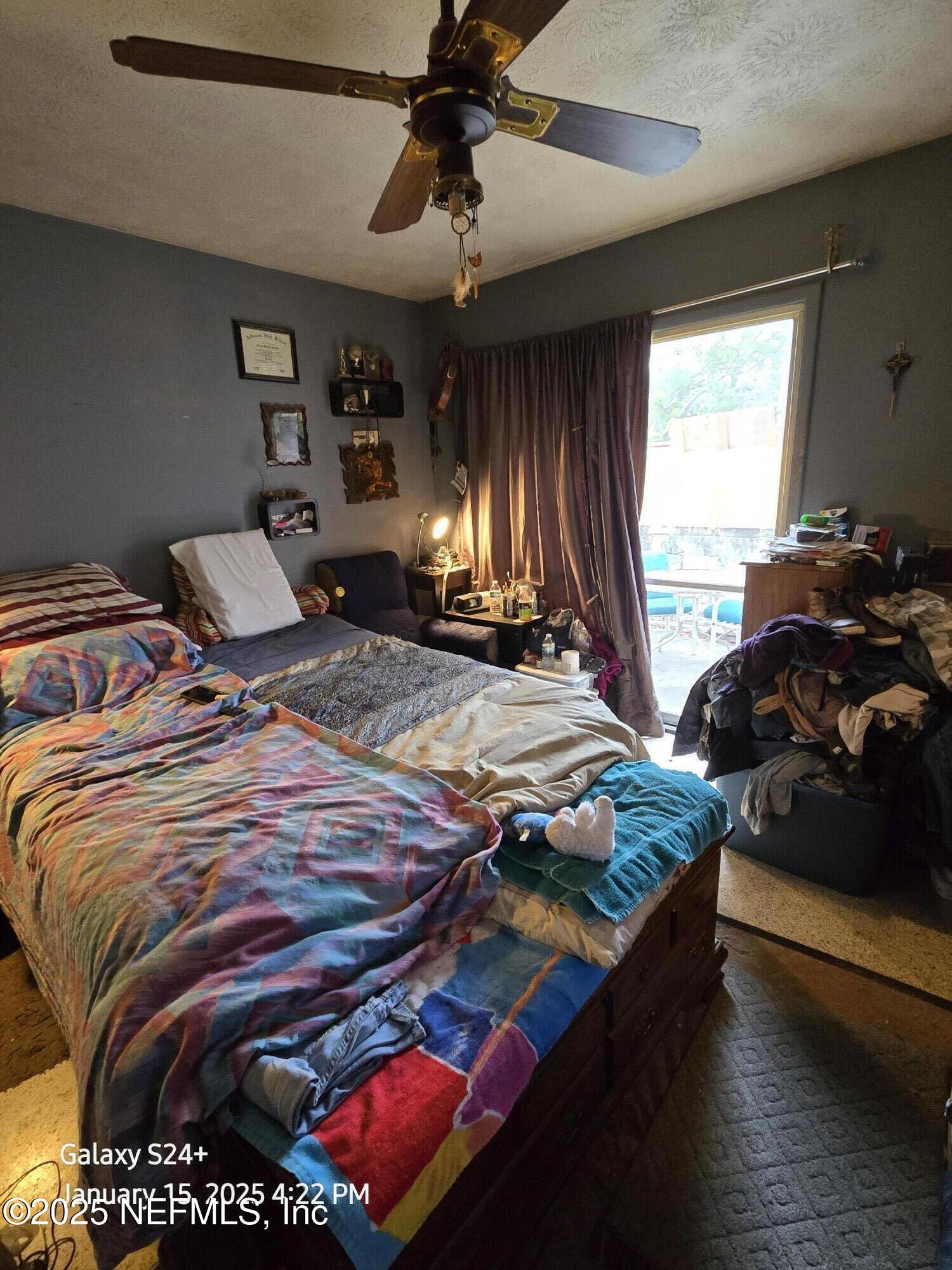 54 Spring Street St. Augustine, FL 32084 - Photo 19 of 31 a bedroom with bed and window