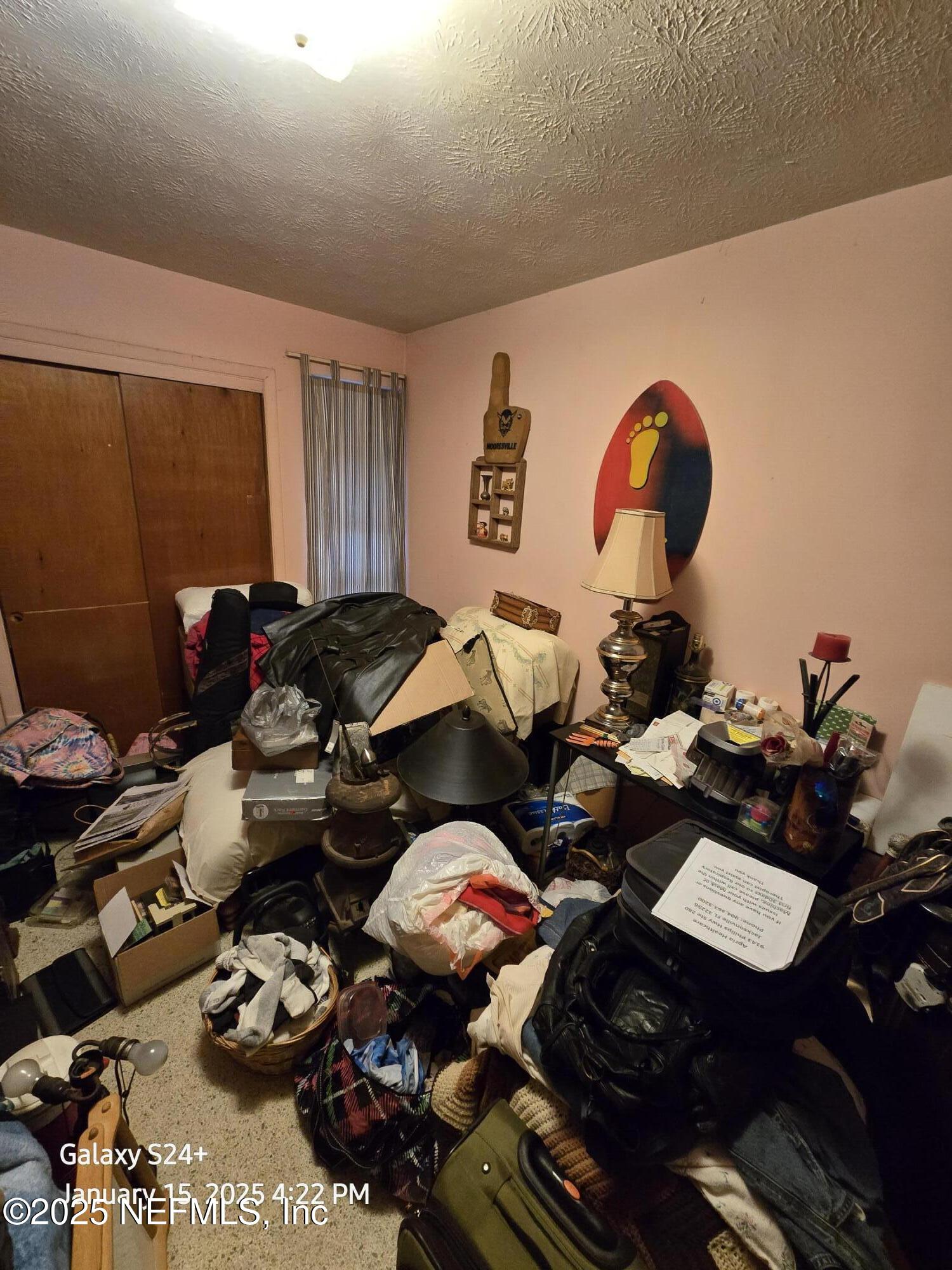 54 Spring Street St. Augustine, FL 32084 - Photo 21 of 31 a living room with furniture a rug and a window