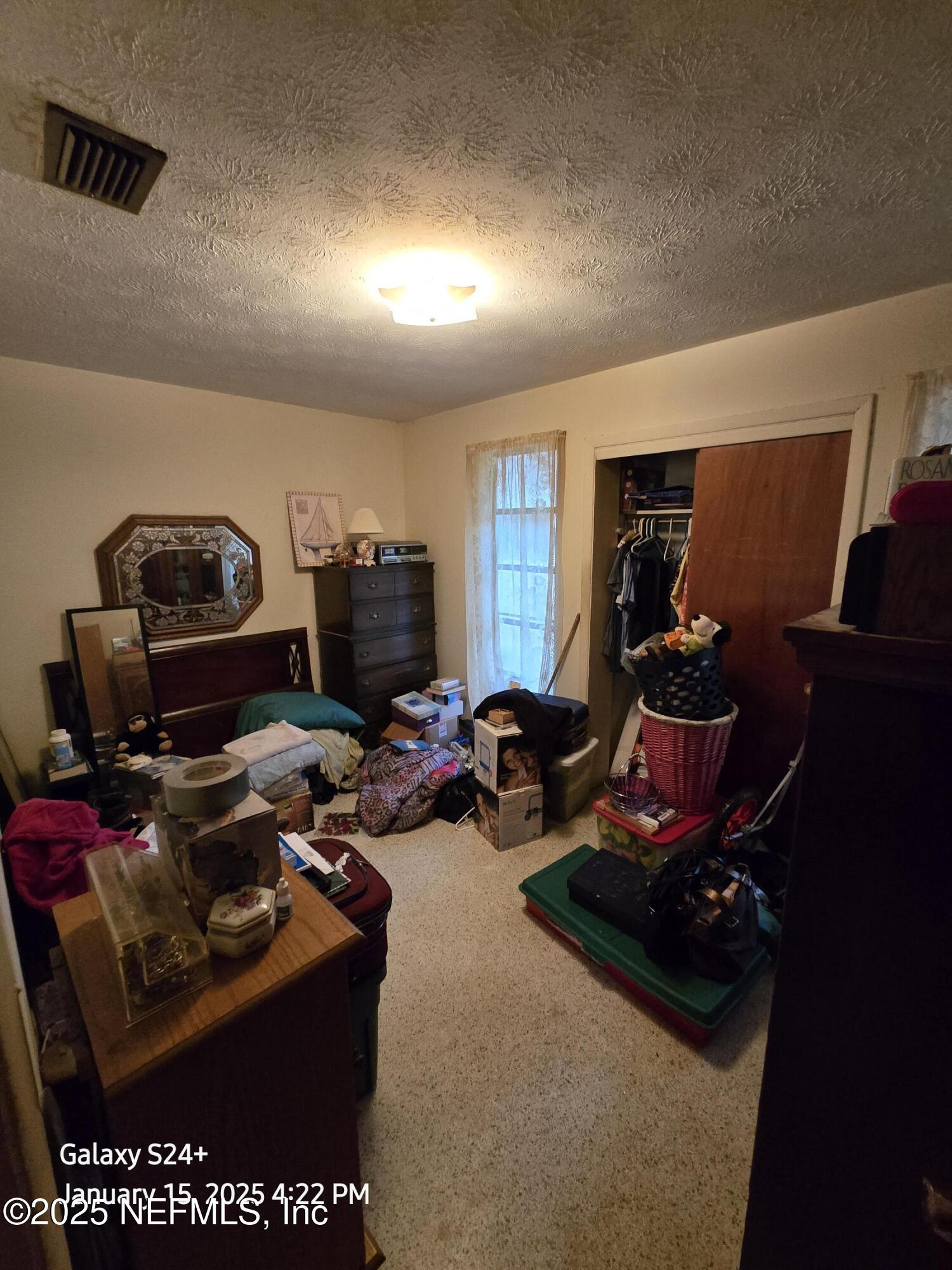 54 Spring Street St. Augustine, FL 32084 - Photo 22 of 31 a room with furniture a rug and gym equipment