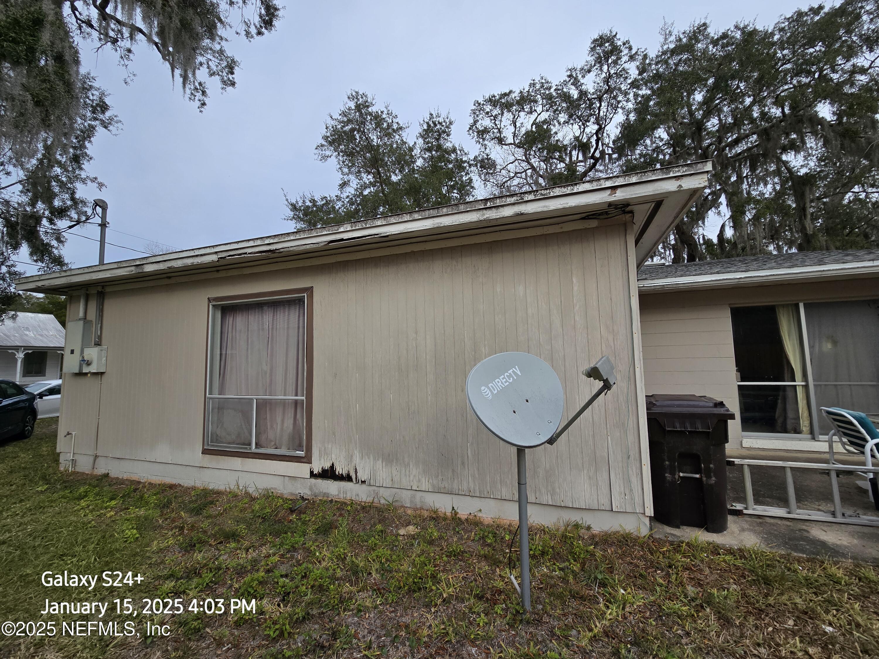 54 Spring Street St. Augustine, FL 32084 - Photo 6 of 31 a backyard of a house with lots of green space
