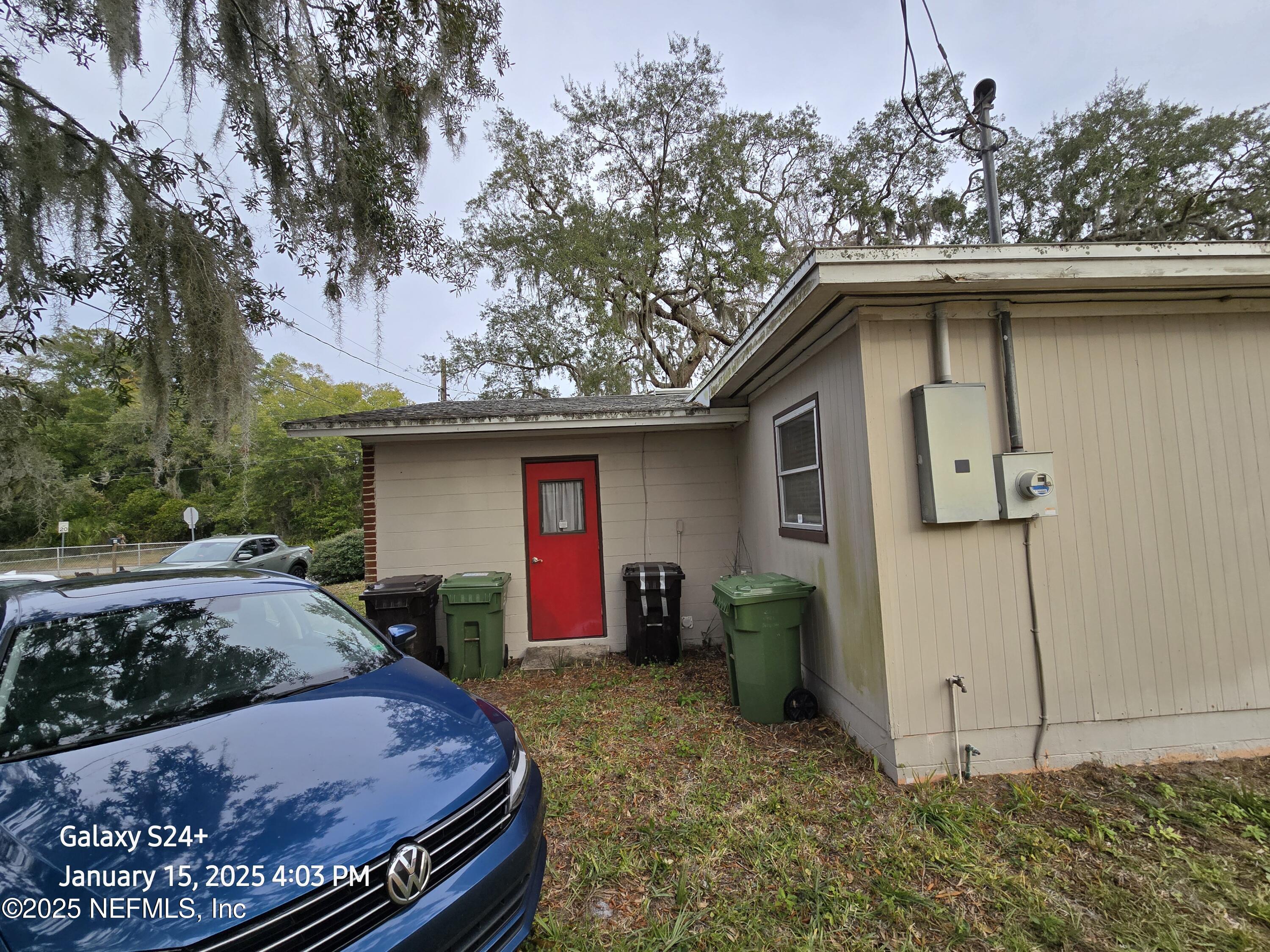54 Spring Street St. Augustine, FL 32084 - Photo 7 of 31 a view of a small house with garage