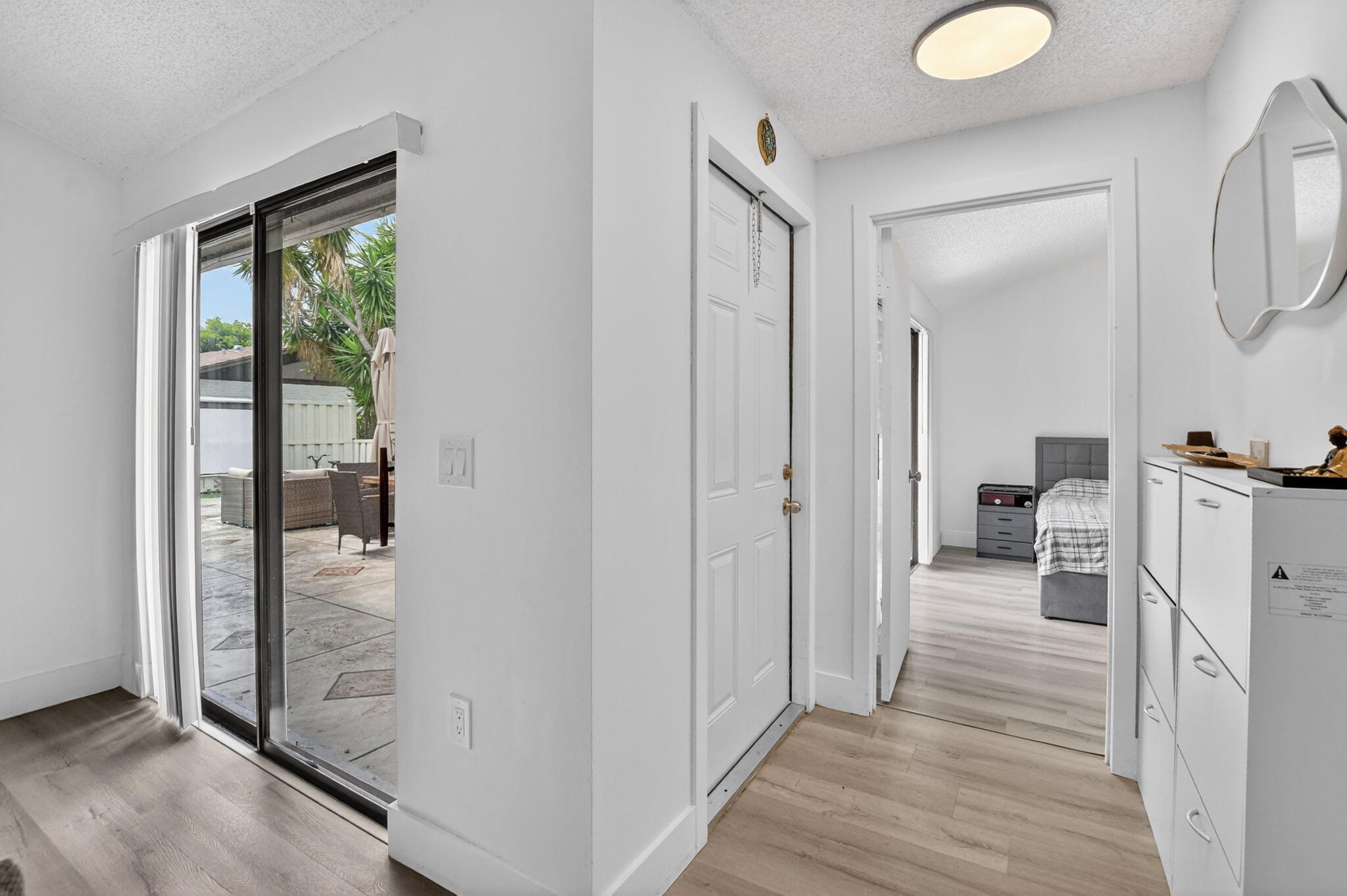9903 Boca Gardens Trail Boca Raton, FL 33496 - Photo 11 of 37 a view of a bathroom from the hallway