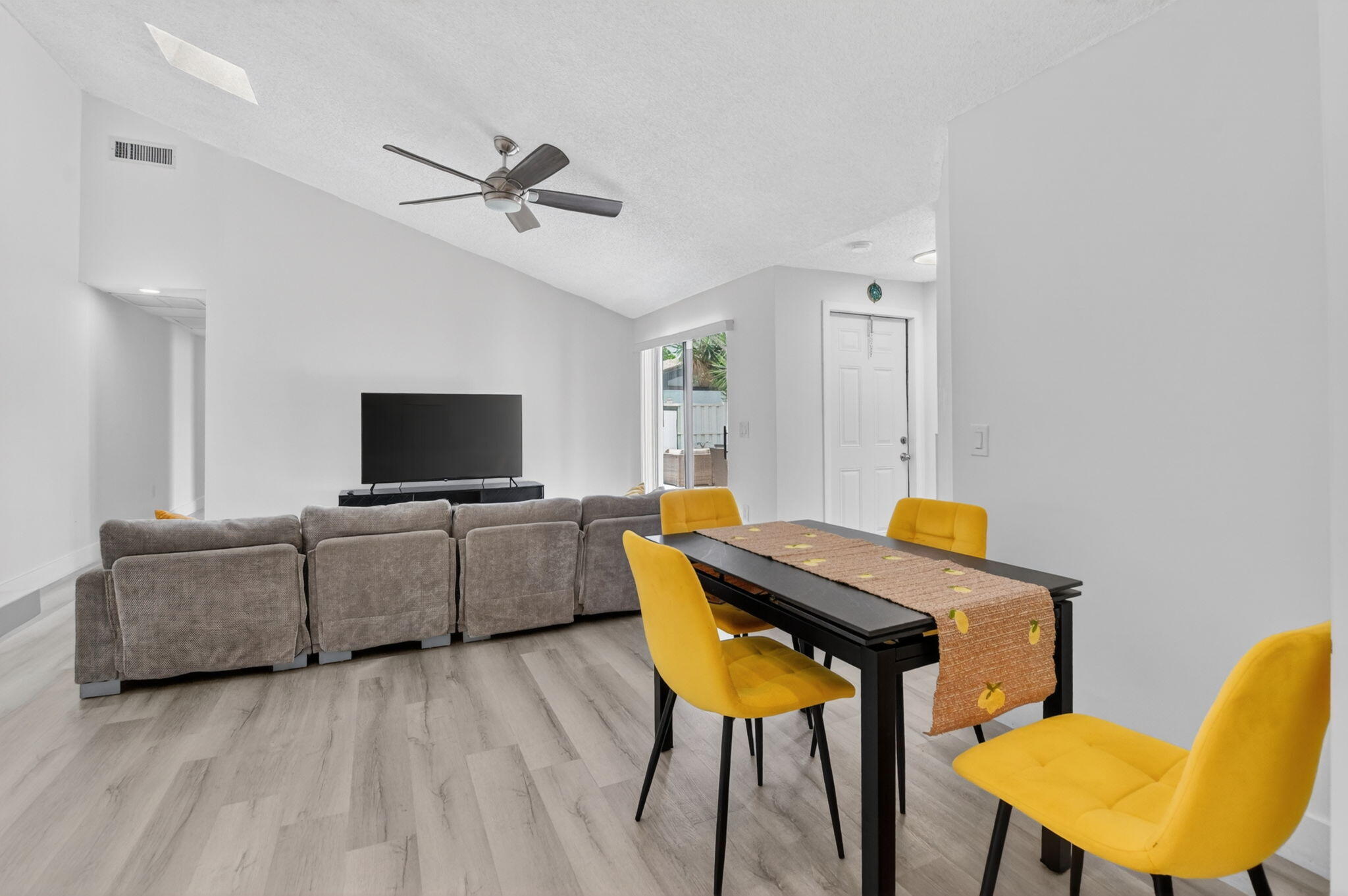 9903 Boca Gardens Trail Boca Raton, FL 33496 - Photo 12 of 37 a living room with furniture and a flat screen tv