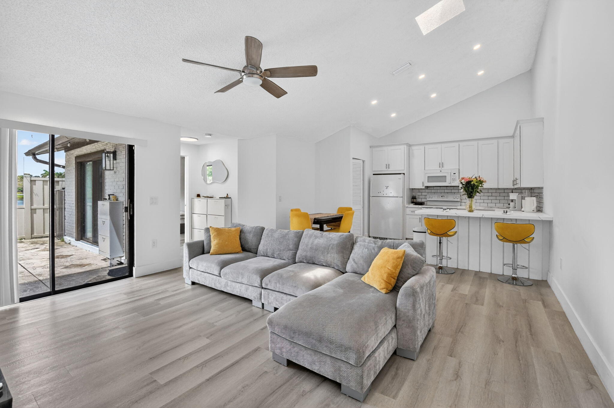 9903 Boca Gardens Trail Boca Raton, FL 33496 - Photo 13 of 37 a living room with furniture and a wooden floor