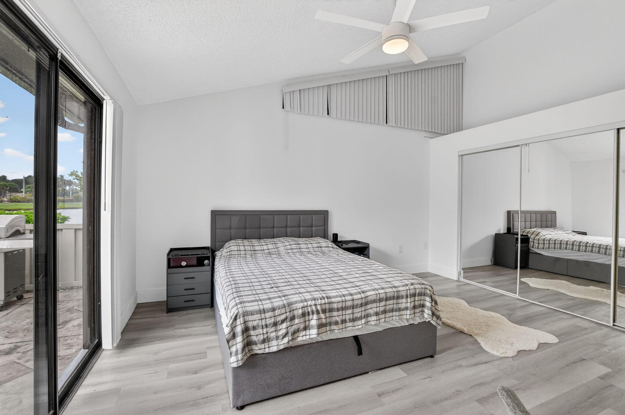 9903 Boca Gardens Trail Boca Raton, FL 33496 - Photo 19 of 37 a bedroom with a bed and a view of bedroom