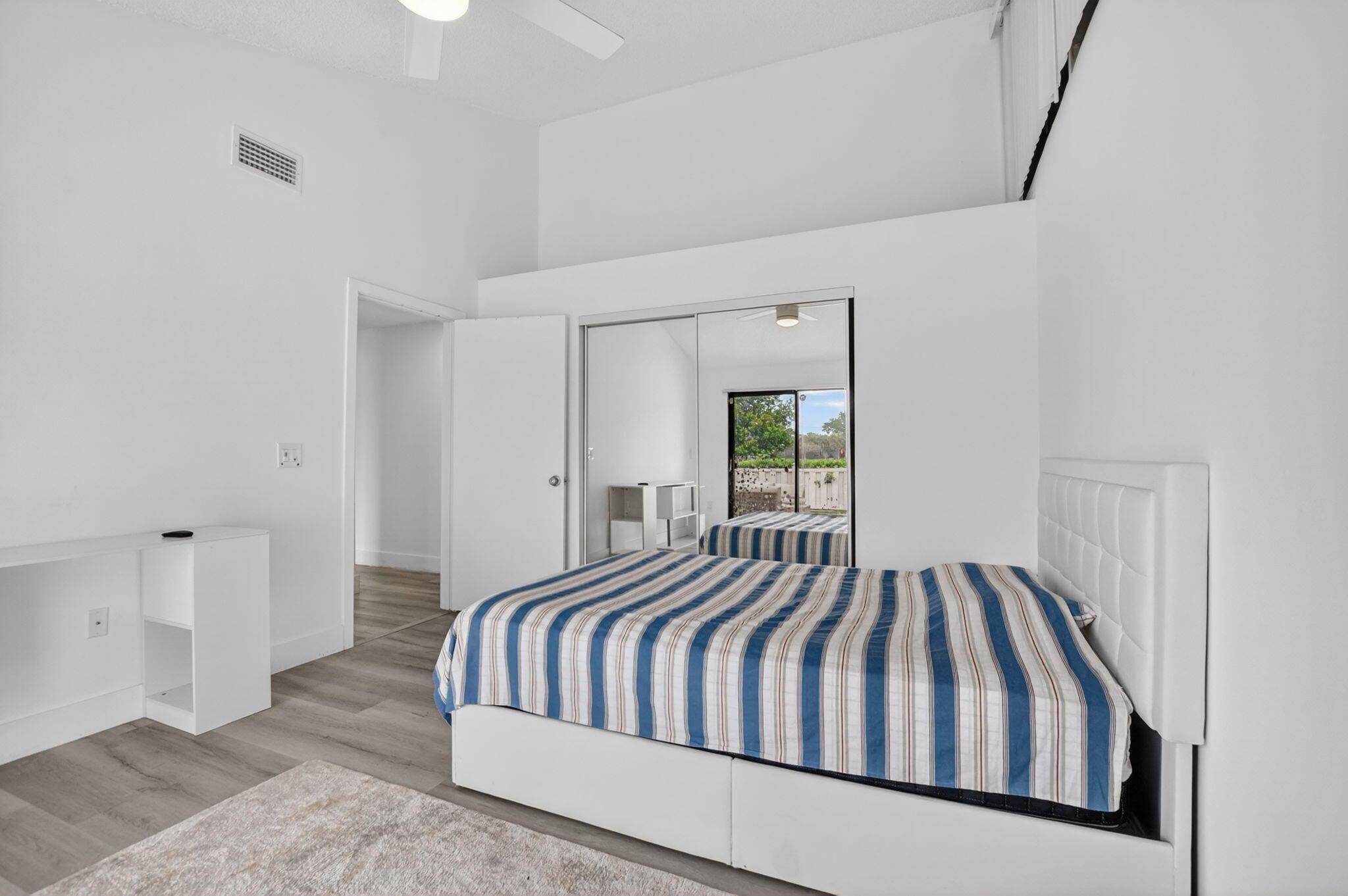 9903 Boca Gardens Trail Boca Raton, FL 33496 - Photo 26 of 37 a bedroom with a bed and a window