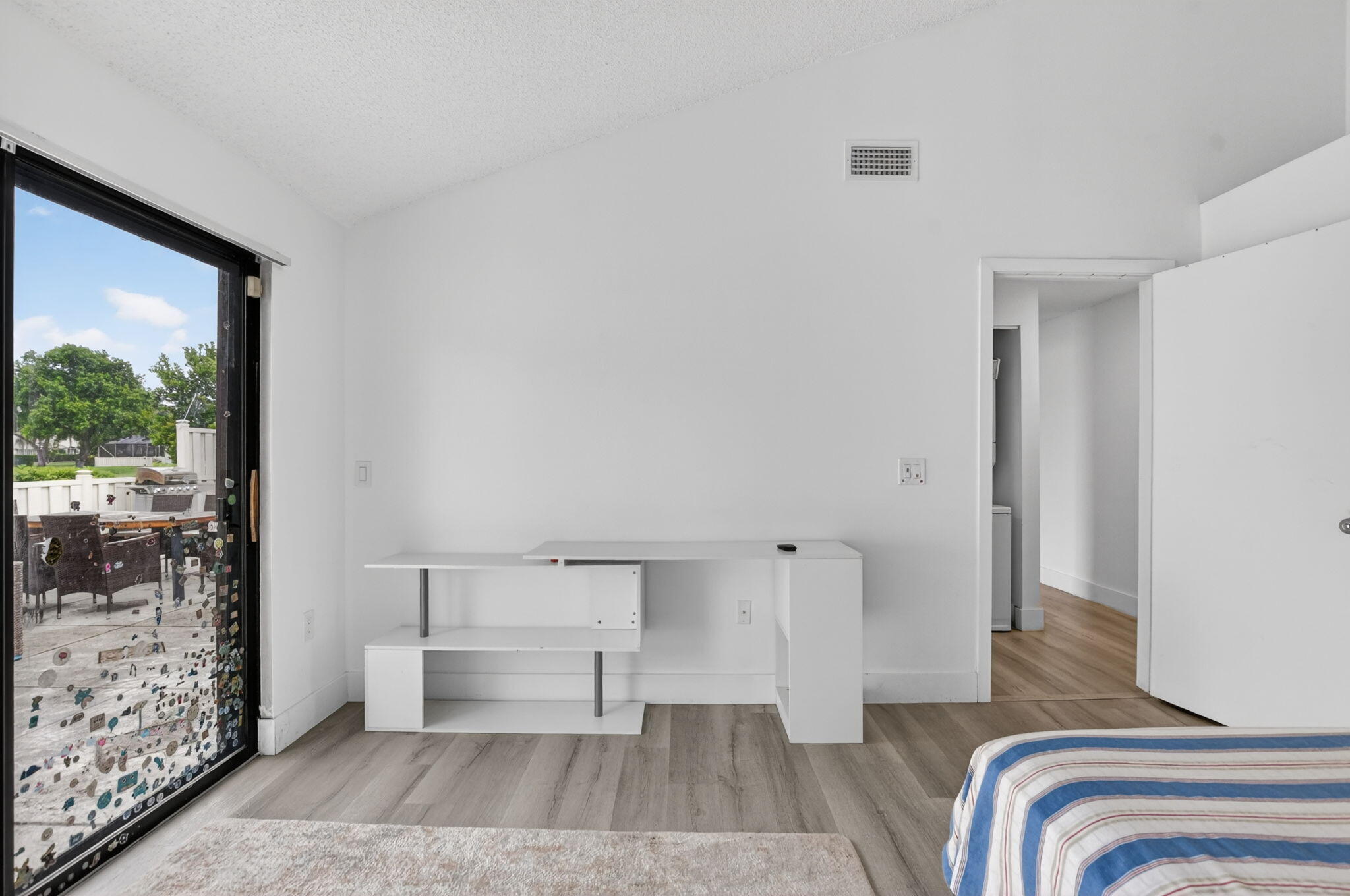 9903 Boca Gardens Trail Boca Raton, FL 33496 - Photo 27 of 37 a bedroom with a bed and a mirror