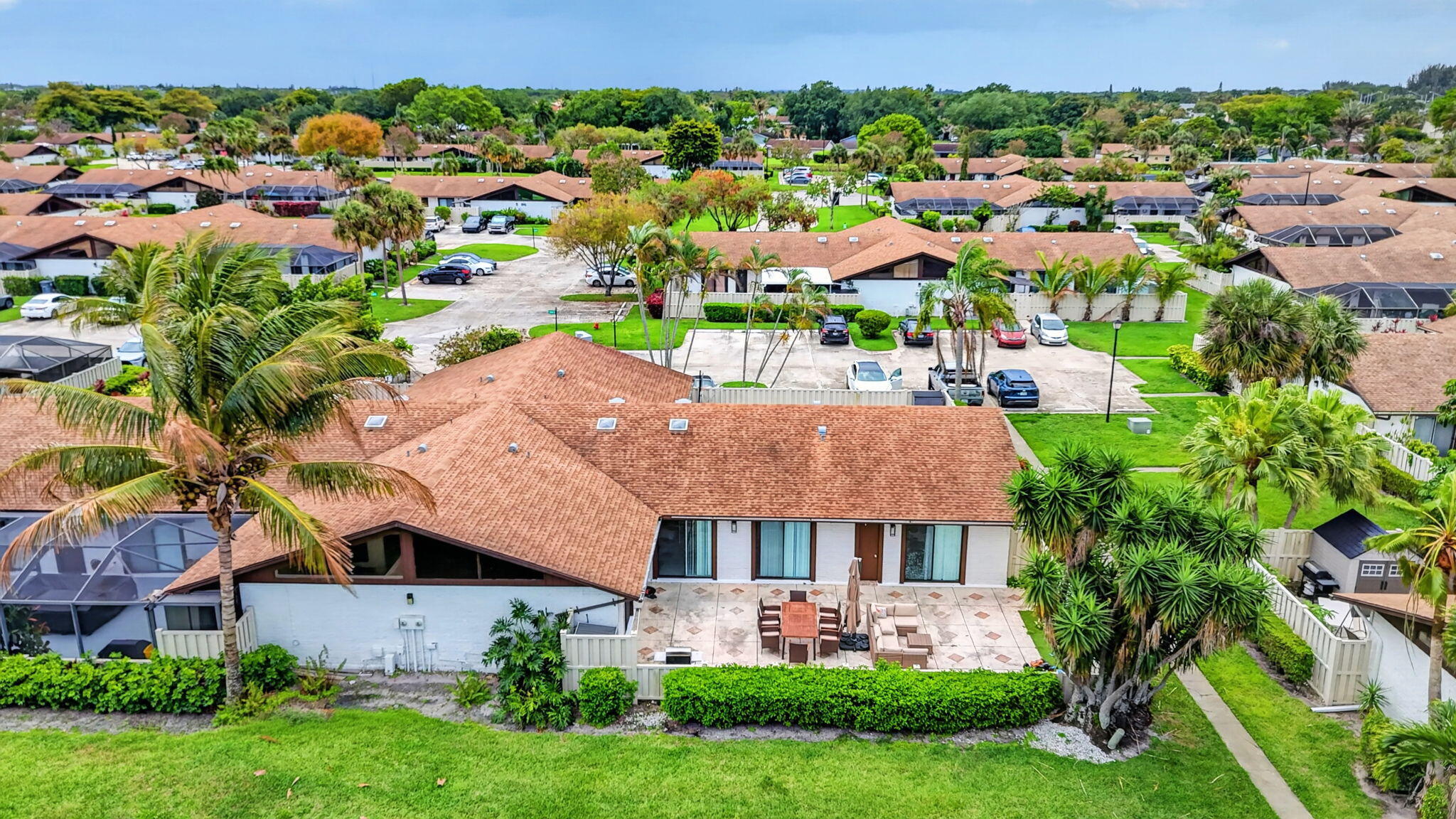 9903 Boca Gardens Trail Boca Raton, FL 33496 - Photo 31 of 37 an aerial view of multiple houses with yard