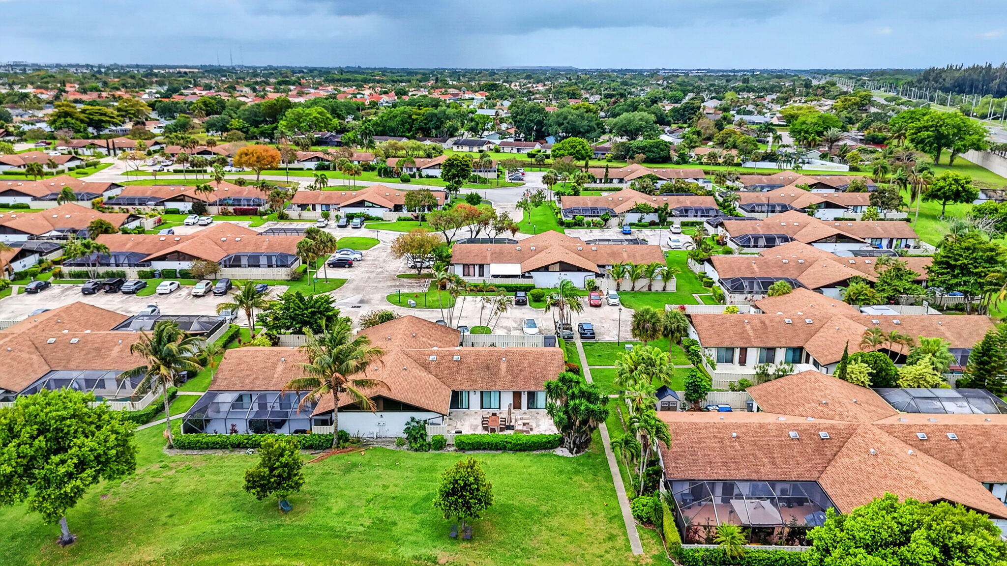 9903 Boca Gardens Trail Boca Raton, FL 33496 - Photo 32 of 37 an aerial view of multiple houses with yard