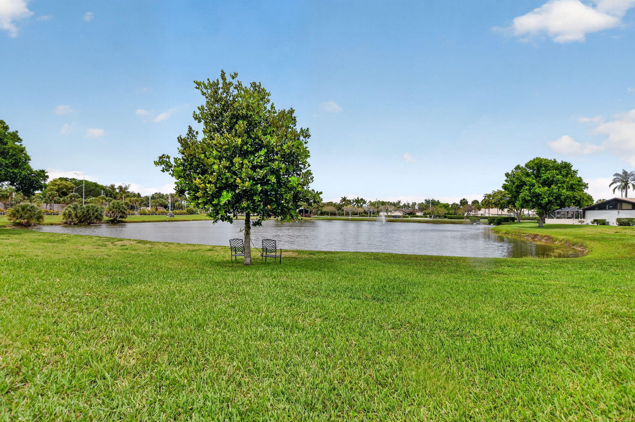 9903 Boca Gardens Trail Boca Raton, FL 33496 - Photo 34 of 37 a view of a lake with a big yard