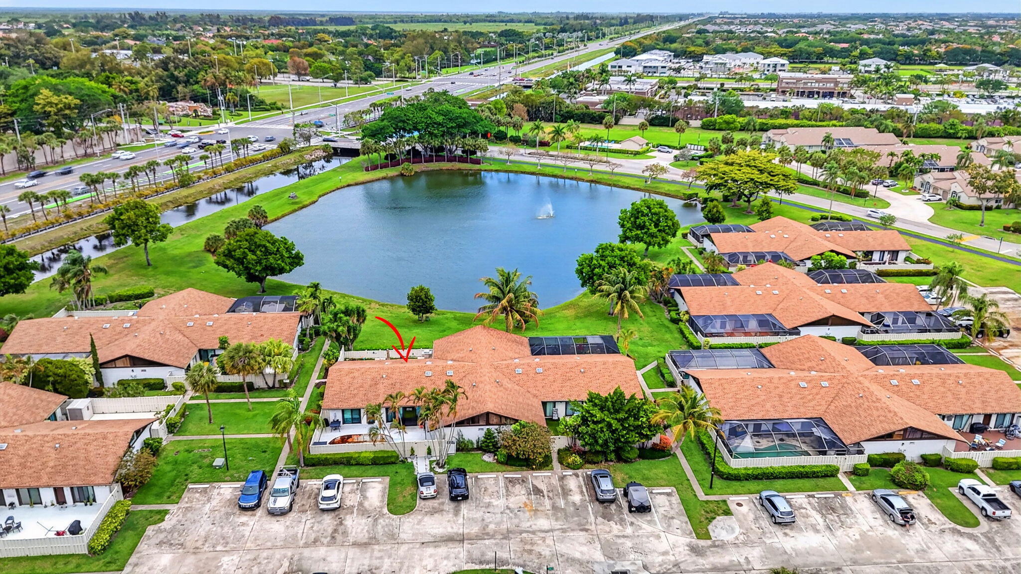 9903 Boca Gardens Trail Boca Raton, FL 33496 - Photo 37 of 37 an aerial view of a city with lots of residential buildings ocean and mountain view in back