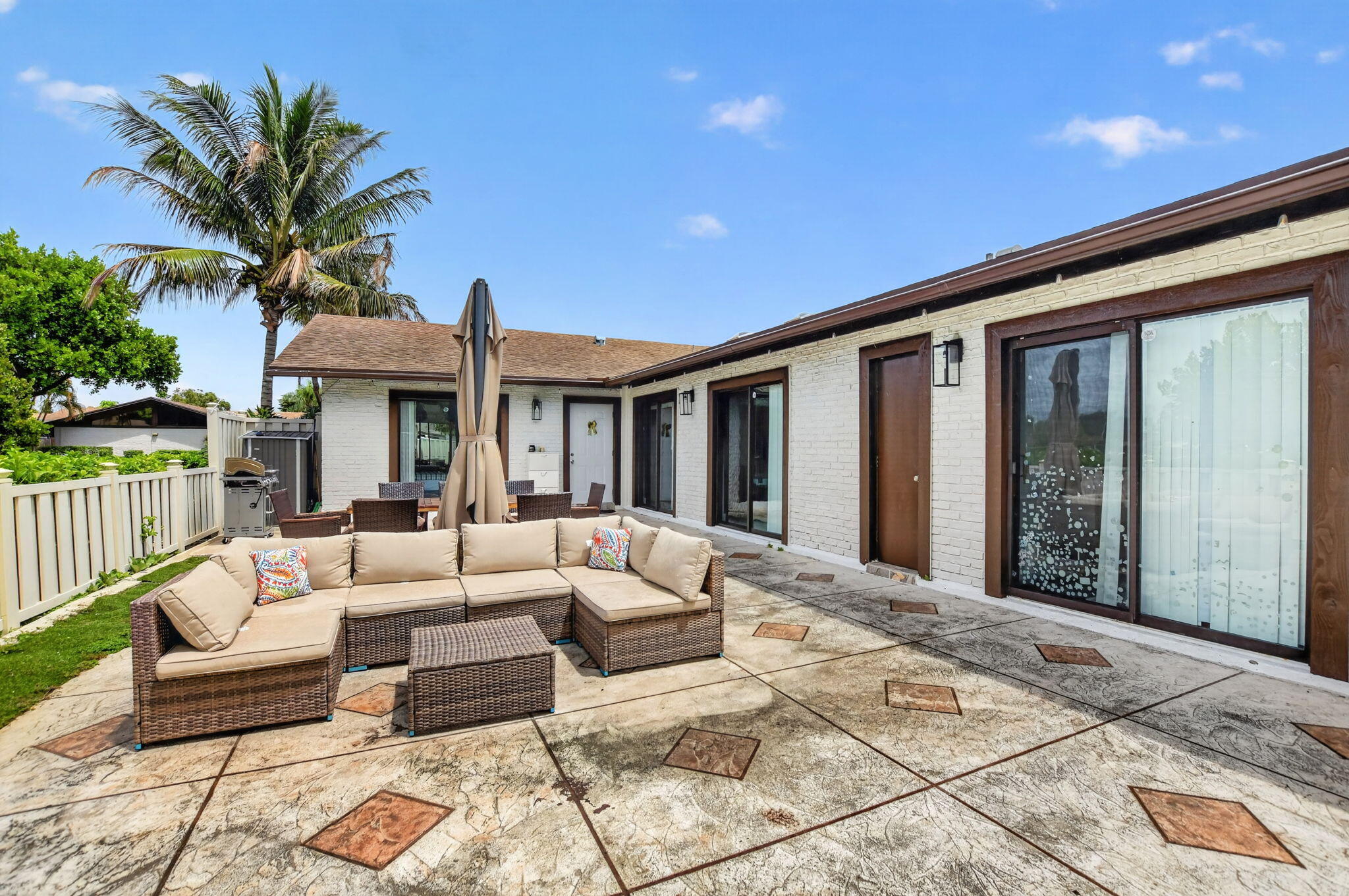 9903 Boca Gardens Trail Boca Raton, FL 33496 - Photo 8 of 37 a view of a patio with couches and potted plants