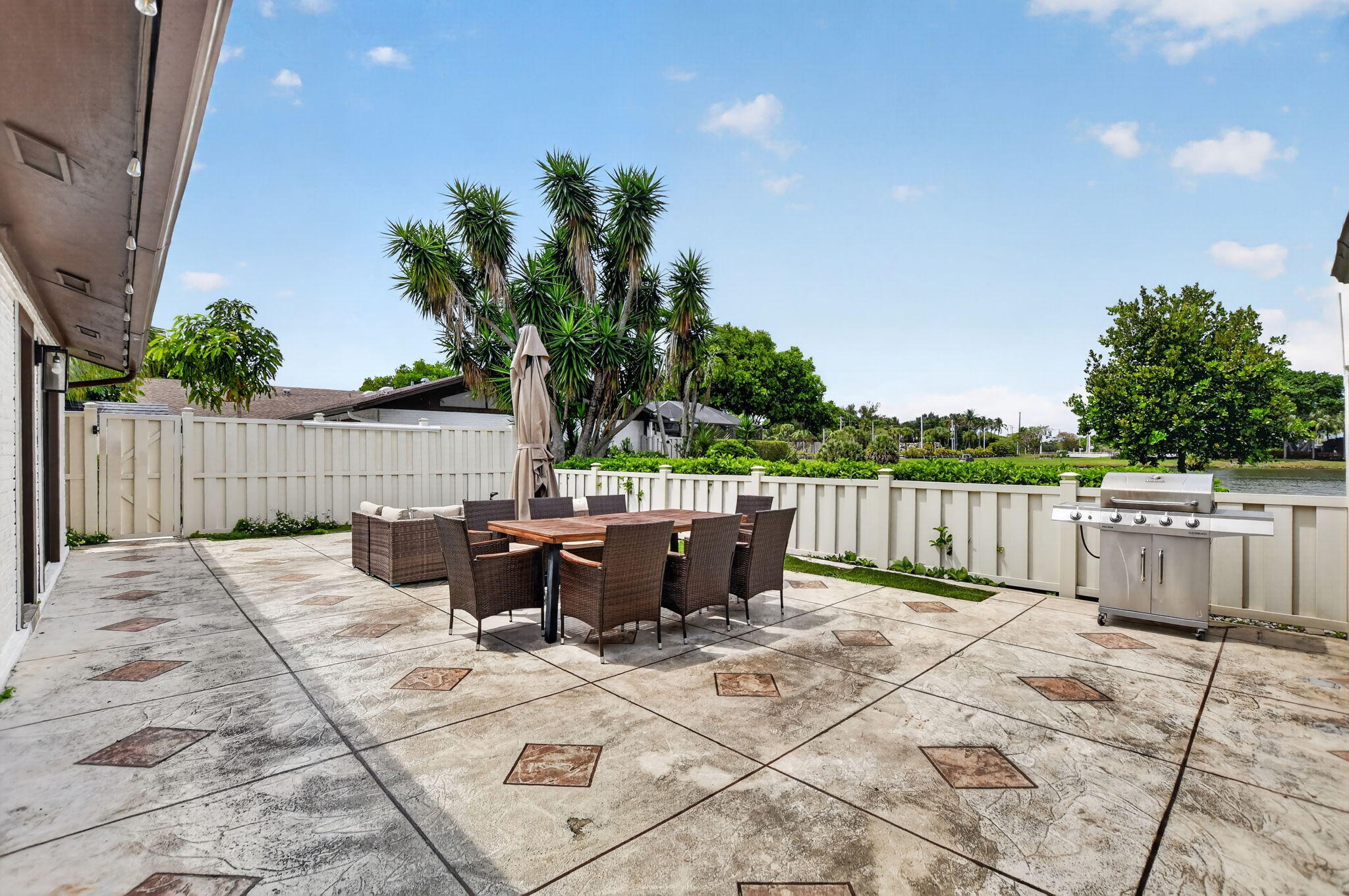 9903 Boca Gardens Trail Boca Raton, FL 33496 - Photo 9 of 37 a view of swimming pool with outdoor seating