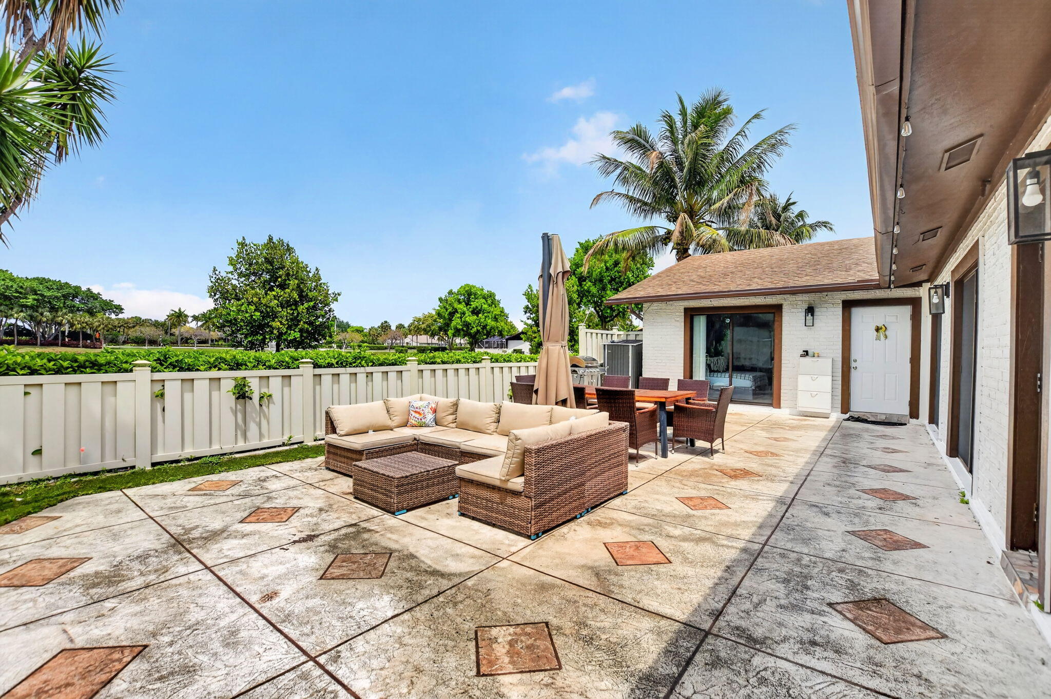 9903 Boca Gardens Trail Boca Raton, FL 33496 - Photo 10 of 37 a view of a house with backyard and sitting area