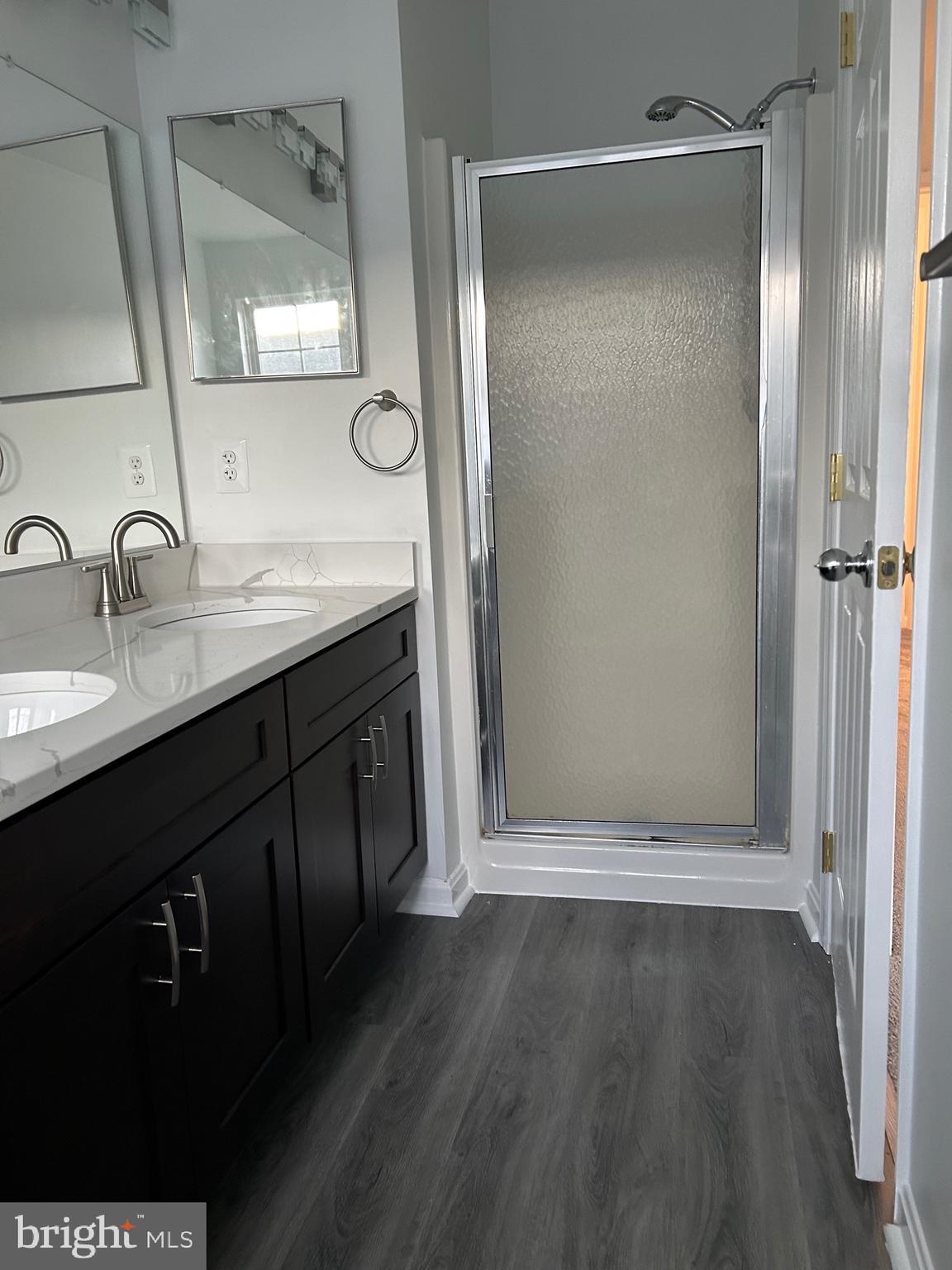 662 Luthardt Road Middle River, MD 21220 - Photo 28 of 52 a bathroom with a double vanity sink and mirror