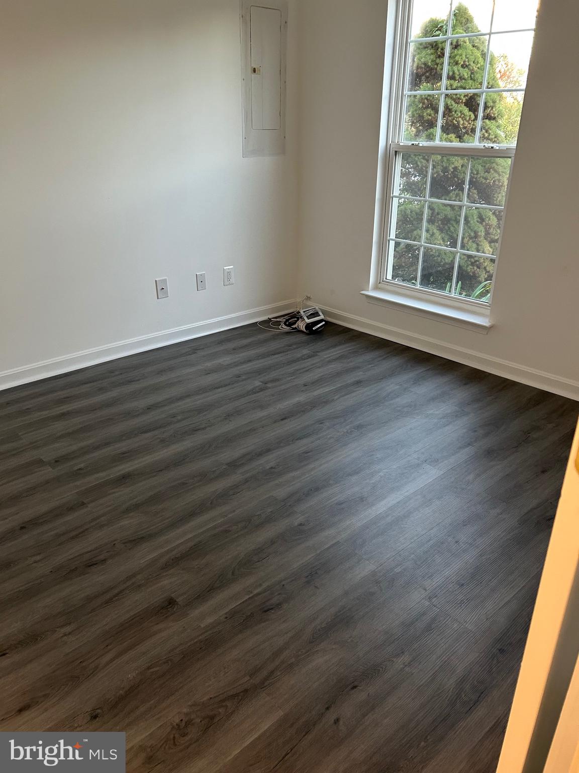 662 Luthardt Road Middle River, MD 21220 - Photo 4 of 52 an empty room with wooden floor and windows
