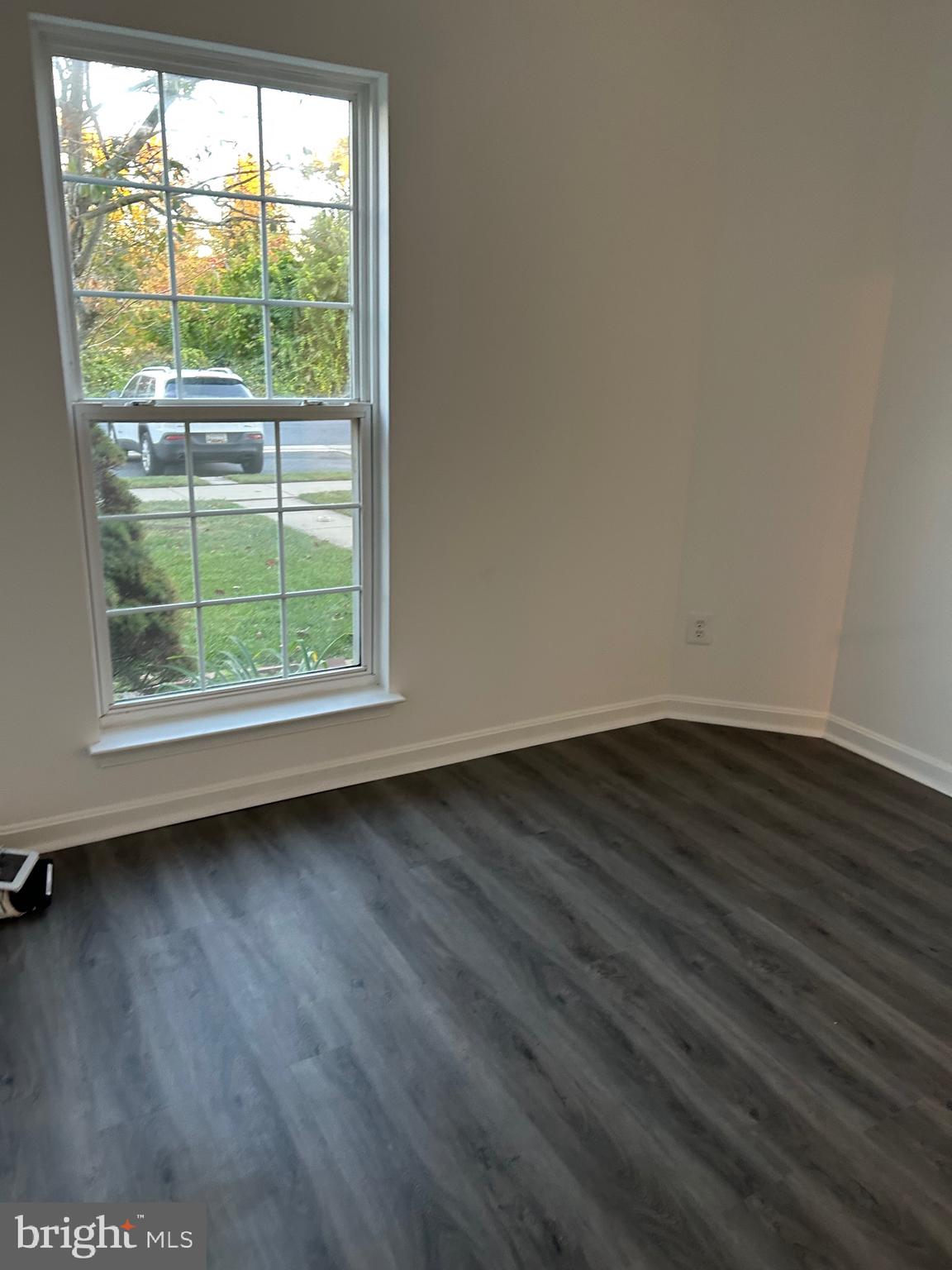 662 Luthardt Road Middle River, MD 21220 - Photo 6 of 52 an empty room with wooden floor and windows