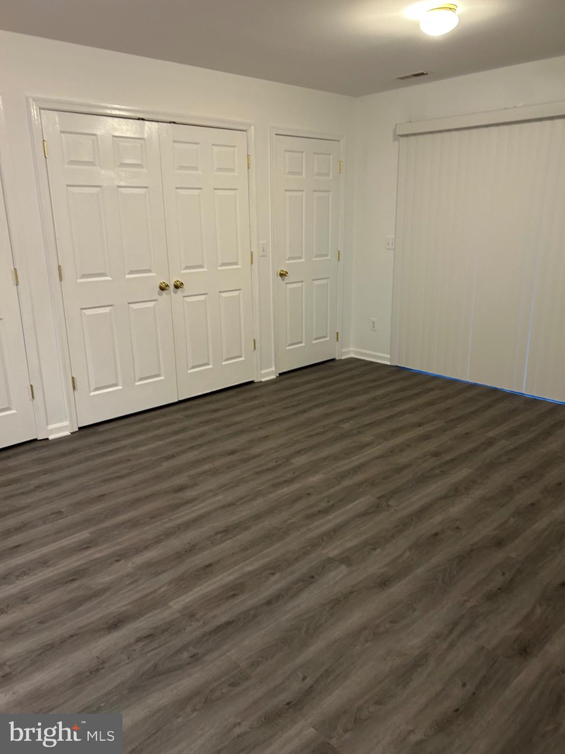 662 Luthardt Road Middle River, MD 21220 - Photo 9 of 52 a view of an empty room with wooden floor