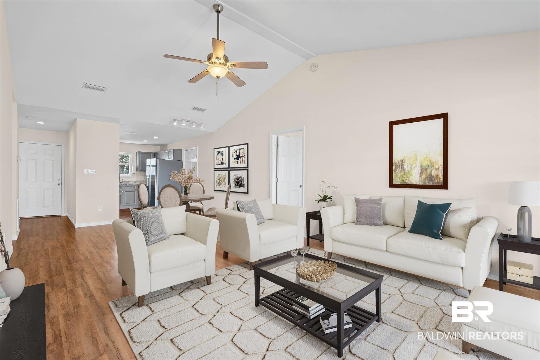 919 Sailor Circle Foley, AL 36535 - Photo 5 of 24 Living area with light wood finished floors, a ceiling fan, and a high ceiling