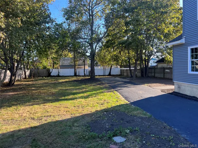 a swimming pool with outdoor seating and yard