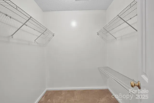 a view of small space with empty racks on the wall