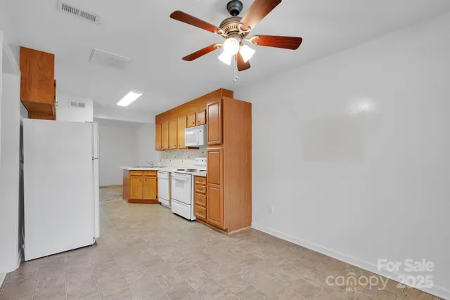 a view of a kitchen with a sink