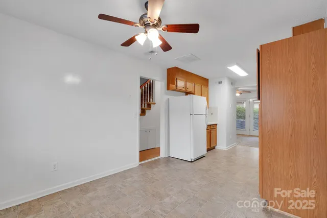 an empty room with a kitchen