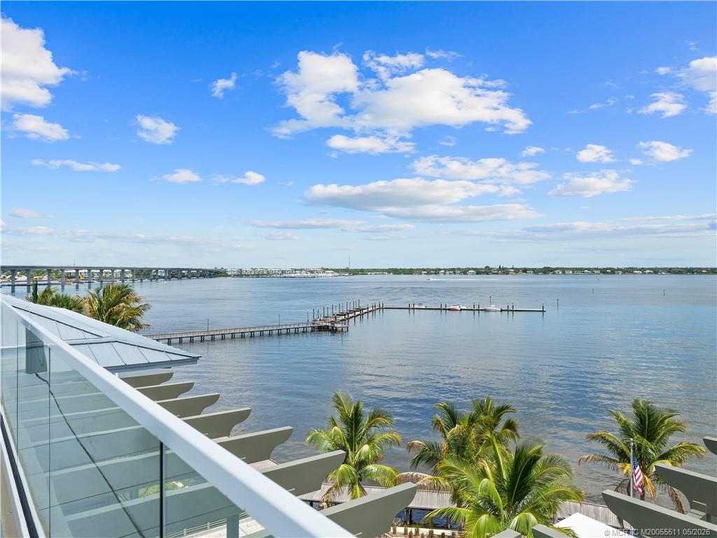 41 Southwest Seminole Street, Unit 208 Stuart, FL 34994 - Photo 40 of 46 a view of a lake with a terrace