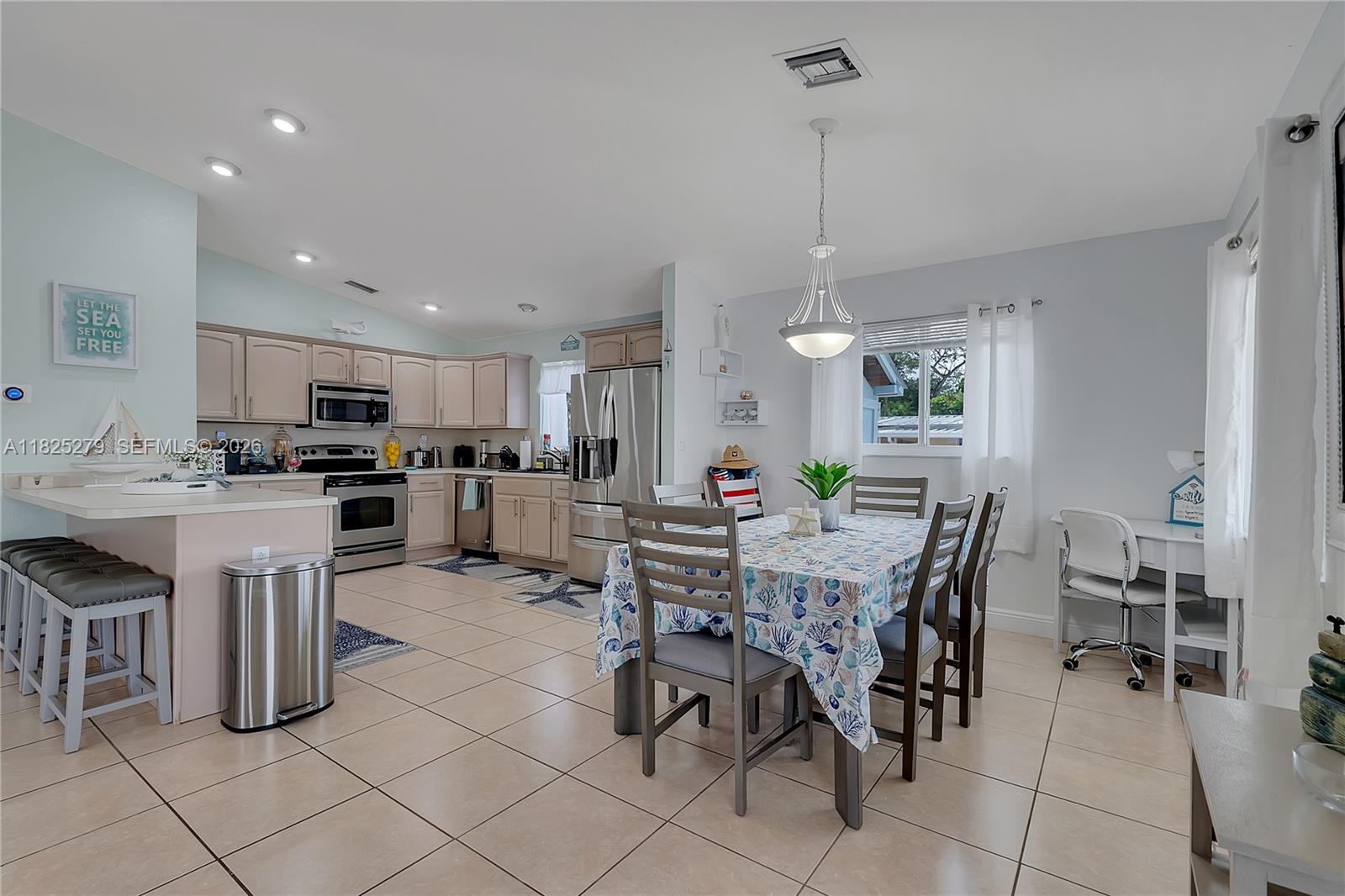 939 Plantation Road Key Largo, FL 33037 - Photo 13 of 40 a view of a dining area with furniture
