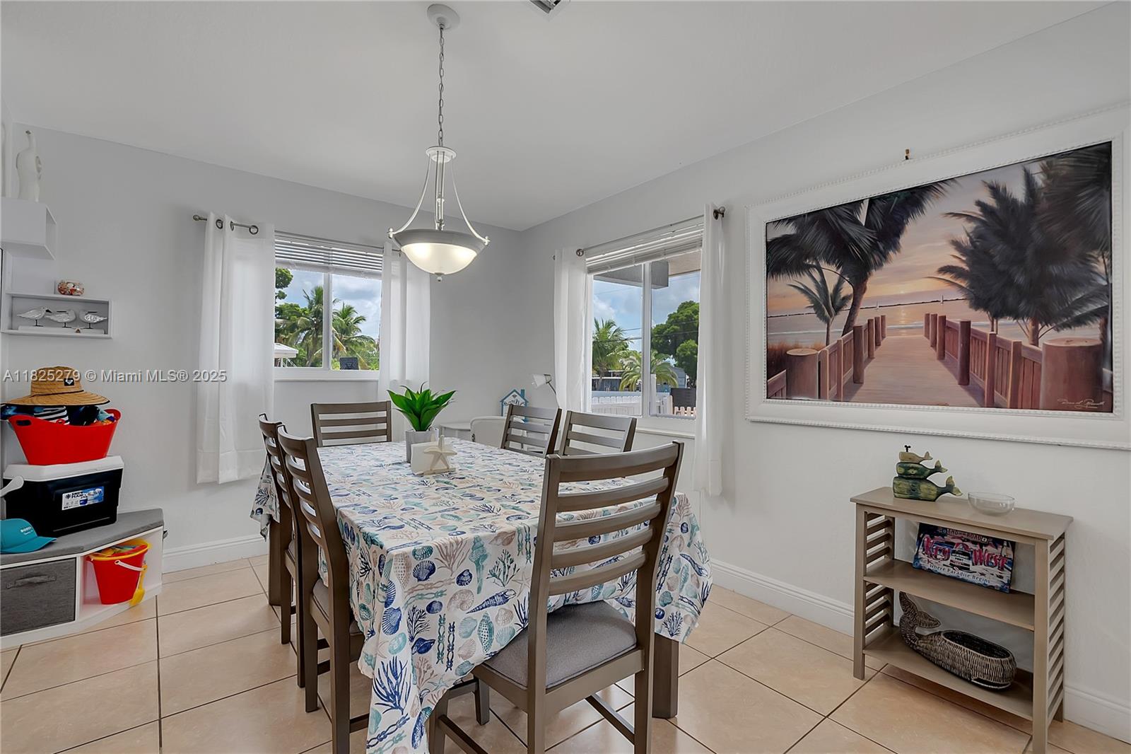939 Plantation Road Key Largo, FL 33037 - Photo 13 of 41 a dining room with furniture and window