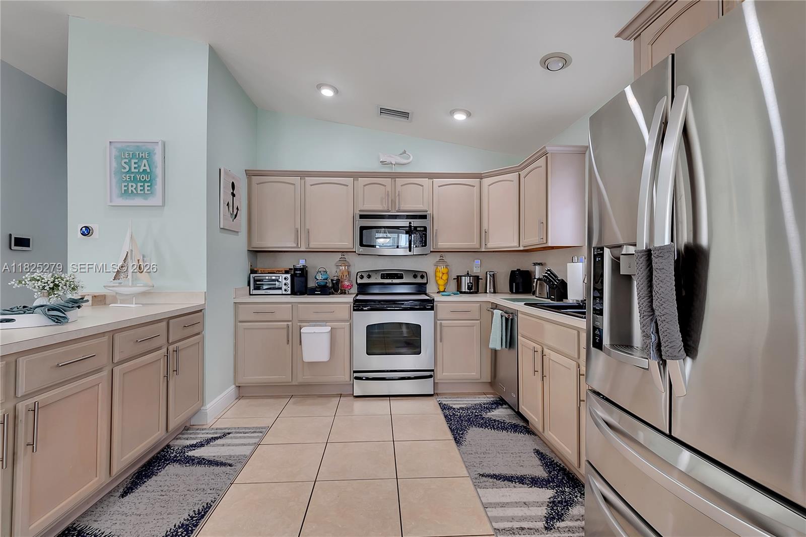 939 Plantation Road Key Largo, FL 33037 - Photo 15 of 40 a kitchen with stainless steel appliances granite countertop a refrigerator sink and stove
