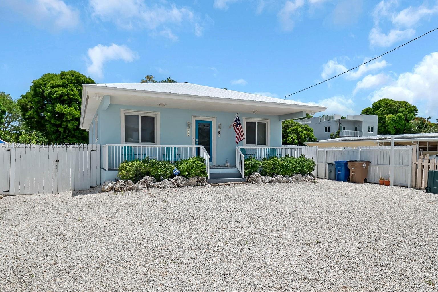 939 Plantation Road Key Largo, FL 33037 - Photo 2 of 40 a view of a house with a yard and potted plants