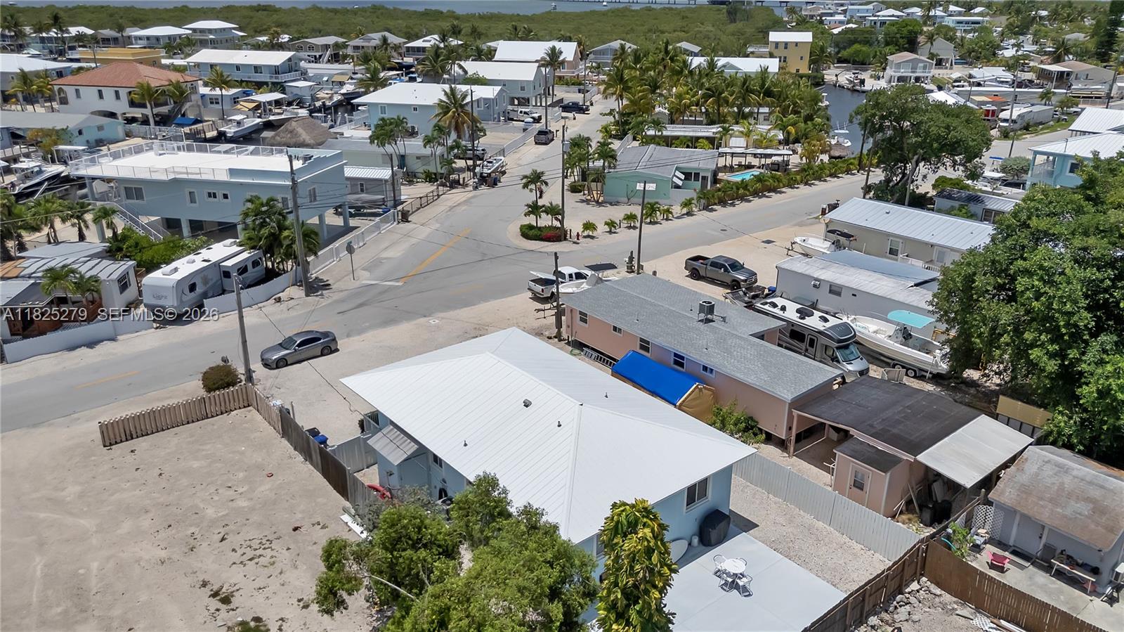 939 Plantation Road Key Largo, FL 33037 - Photo 40 of 40 an aerial view of a house with a yard and lake view