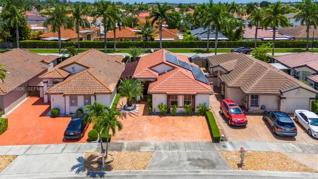 a view of multiple houses with a yard