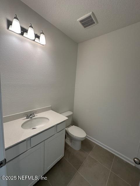 33 Chaste Tree Lane St. Augustine, FL 32092 - Photo 17 of 34 a bathroom with a sink a toilet and a mirror