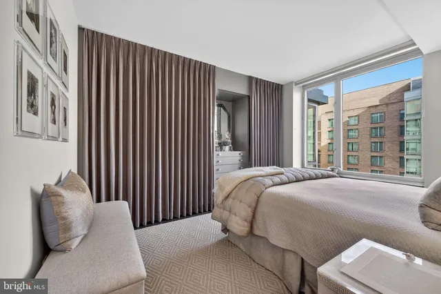 a view of a hallway with wooden staircase