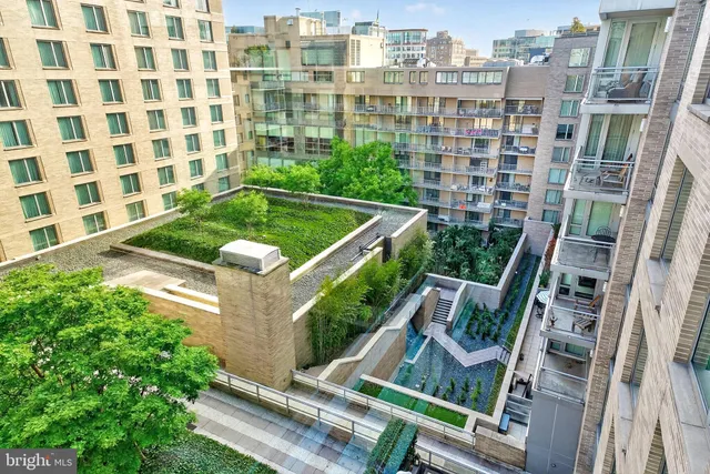 a kitchen with white cabinets and appliances