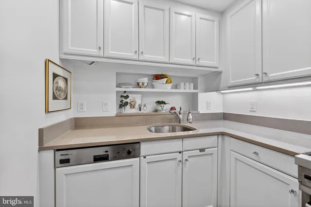 a bedroom with a large bed and a large window