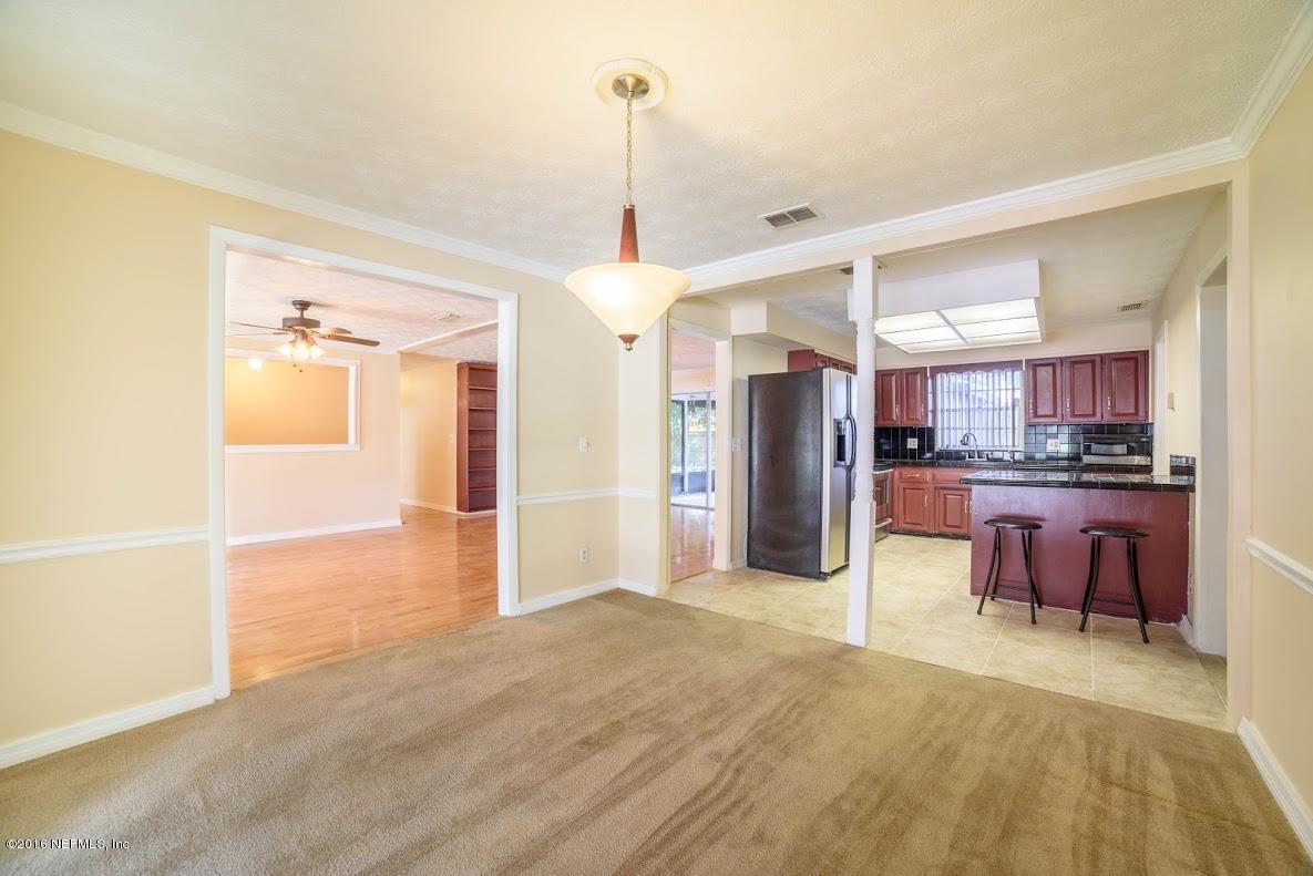 3888 Raintree Road Jacksonville, FL 32277 - Photo 3 of 26 1.b Living Room Kitchen and Dining