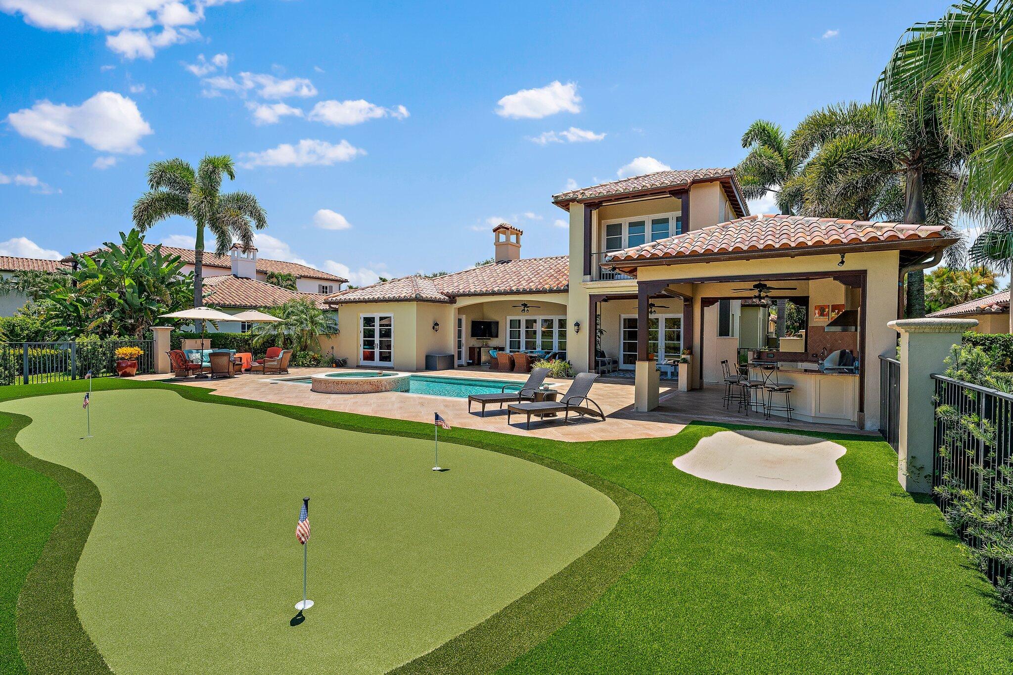 438 Red Hawk Drive Jupiter, FL 33477 - Photo 106 of 116 a view of a house with swimming pool and sitting area