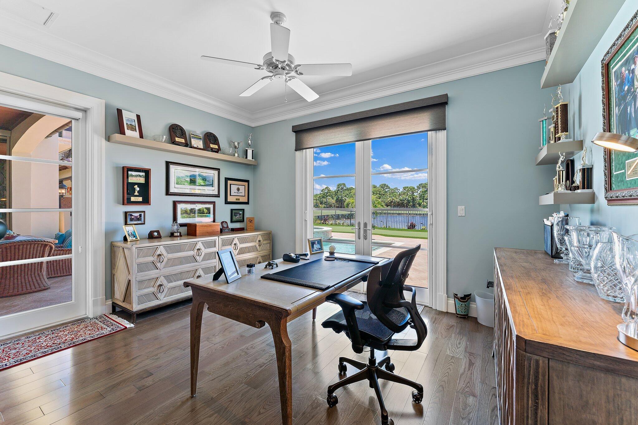 438 Red Hawk Drive Jupiter, FL 33477 - Photo 13 of 116 a view of a dining room with furniture window and wooden floor