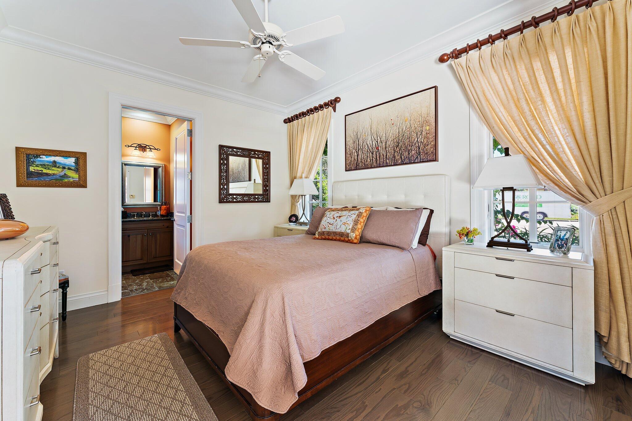 438 Red Hawk Drive Jupiter, FL 33477 - Photo 15 of 116 a bed room with a bed and a chandelier