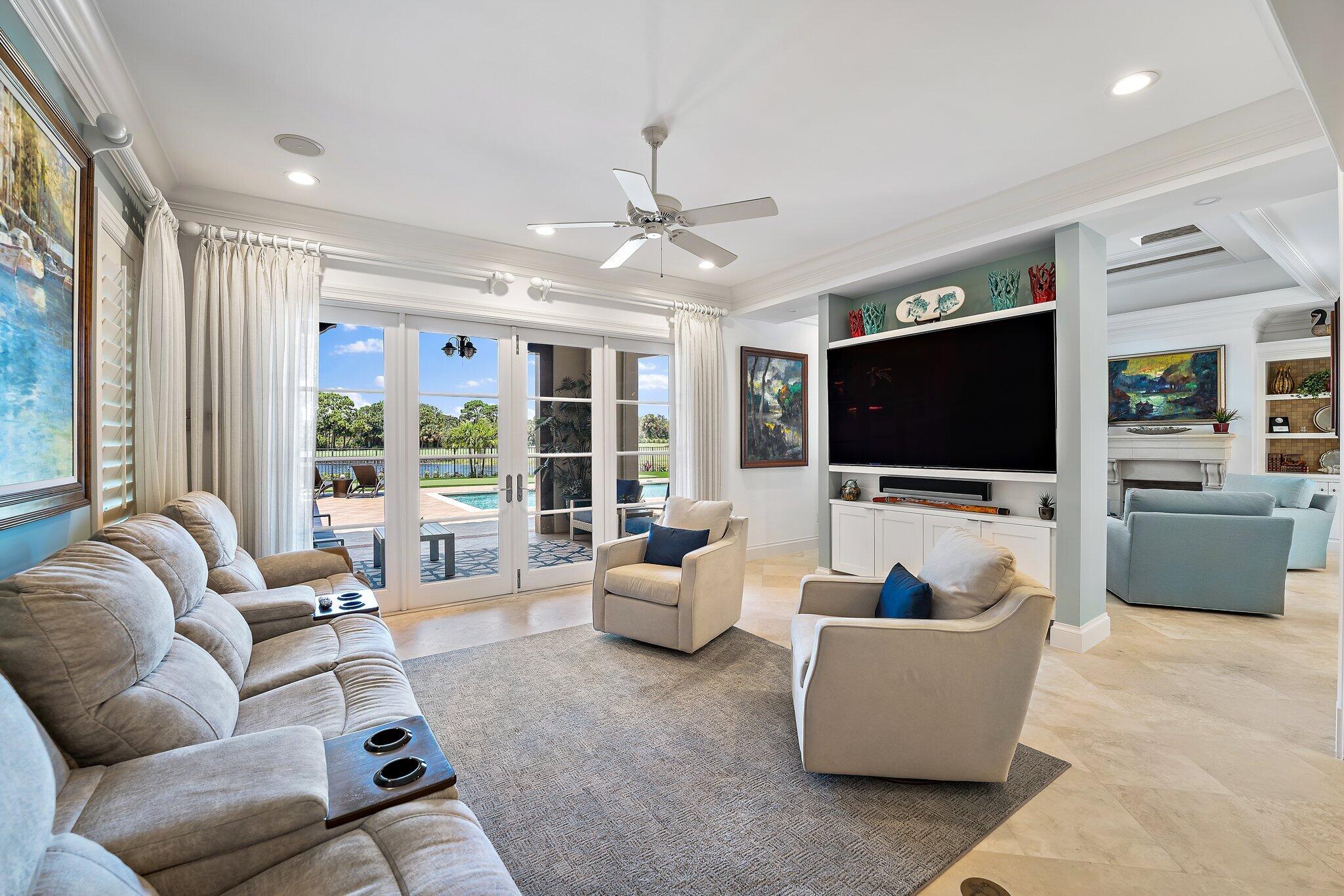 438 Red Hawk Drive Jupiter, FL 33477 - Photo 4 of 116 a living room with furniture and a flat screen tv